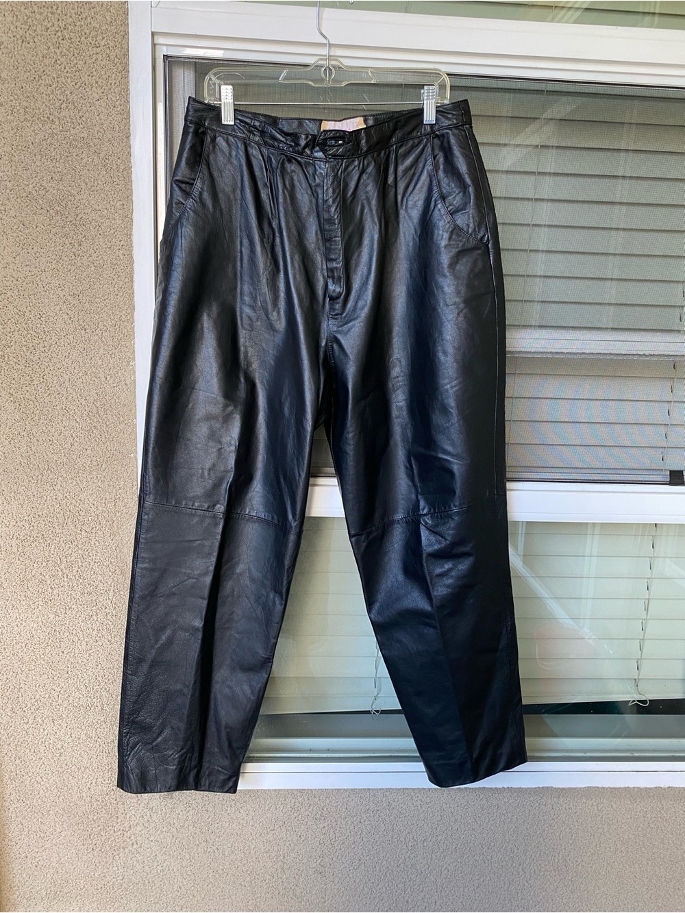 Woman Black Leather Pants Silhouette: High-rise waist with a voluminous, relaxed